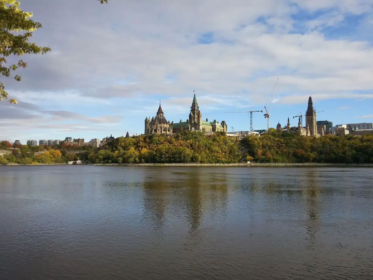 Parliament Hill across the Ottawa River in October